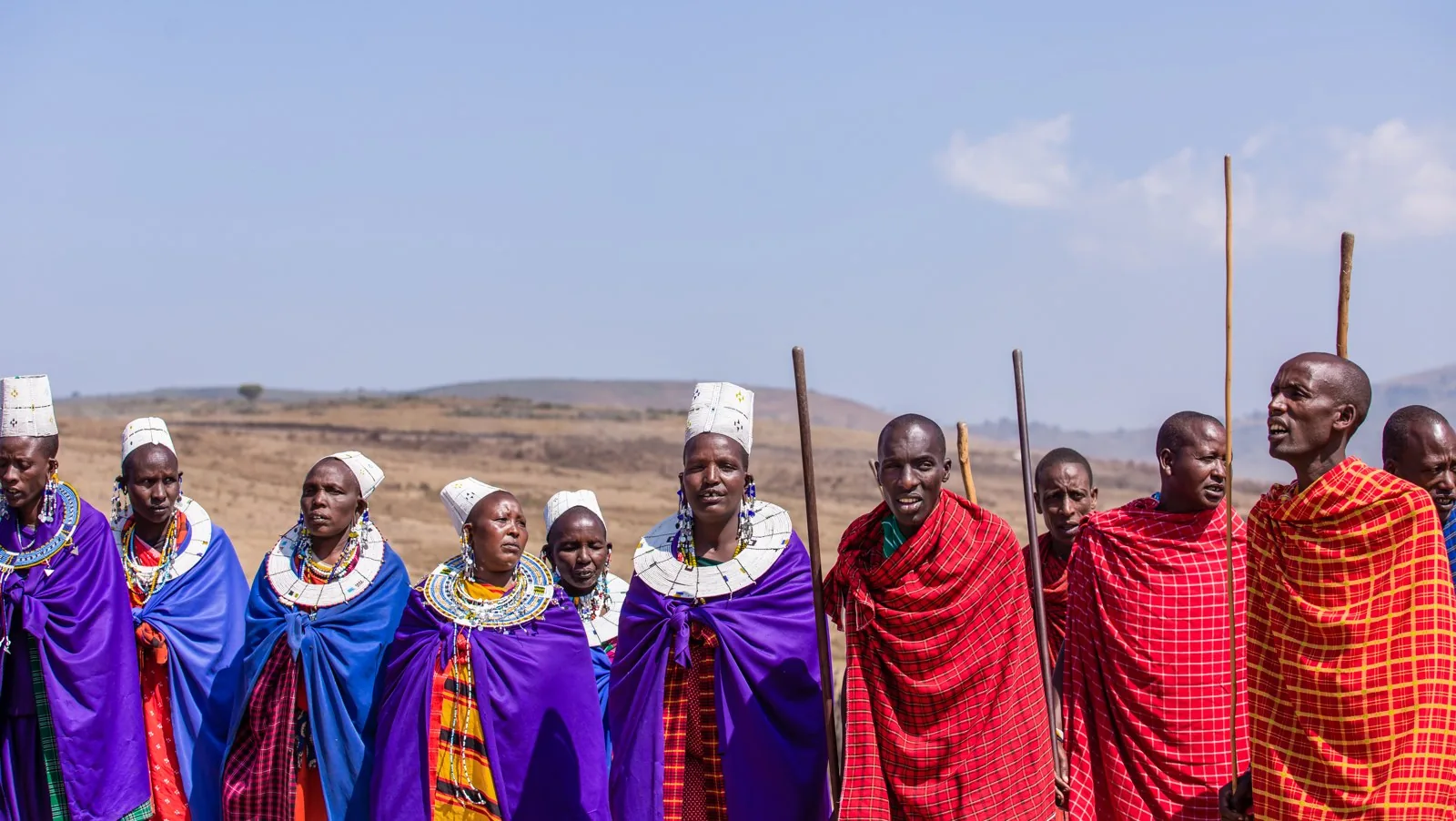 Maasai women and men performing a cultural dance in Ngorongoro